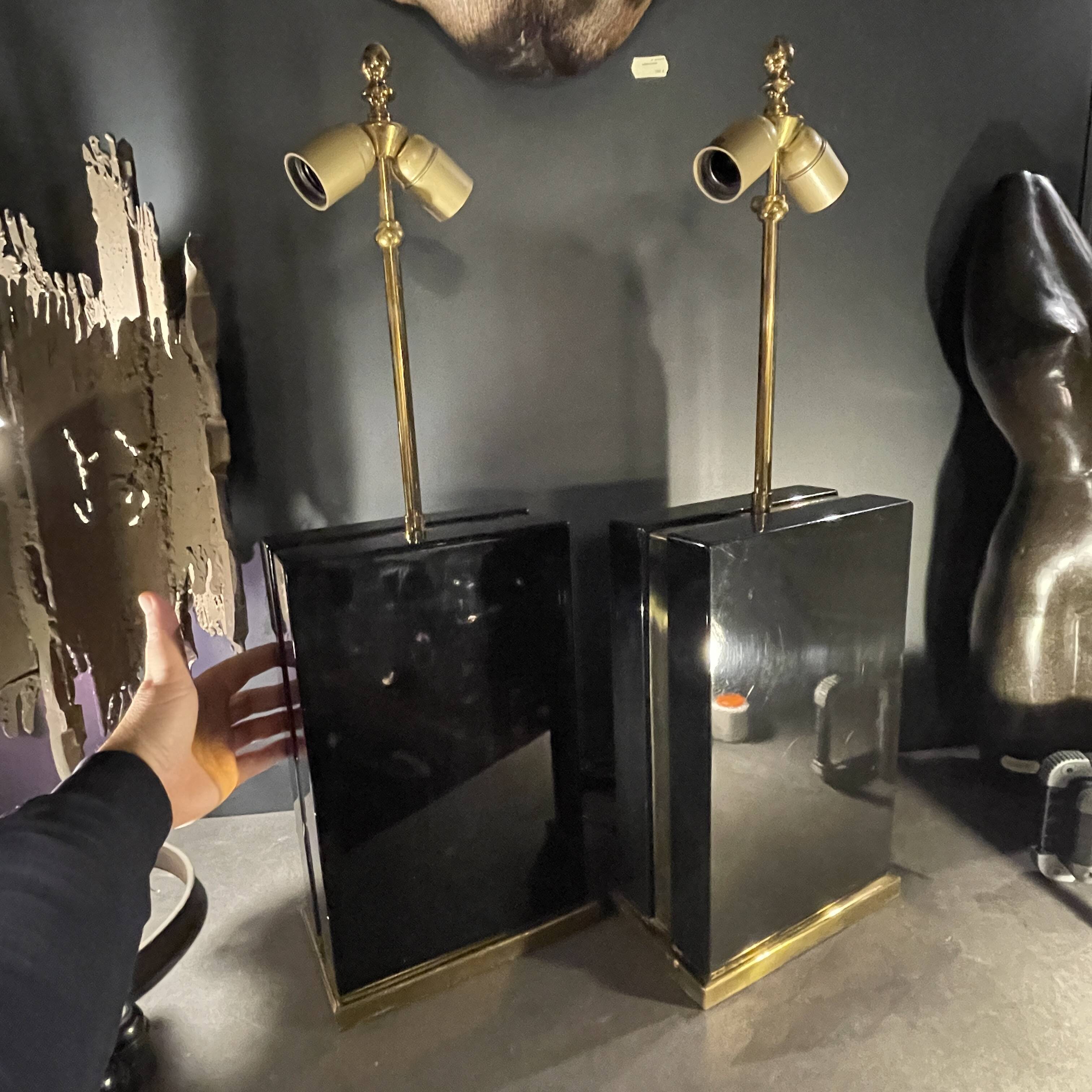 Pair of black lacquered and brass table lamps, circa 1970