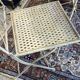 Foldable garden or terrace furniture set made of sheet metal and woven, perforated wrought iron, 5 pieces.