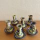 Many old glazed terracotta candlesticks.