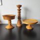 Vintage decor trio: candlestick and light wood bowls in Scandinavian style.