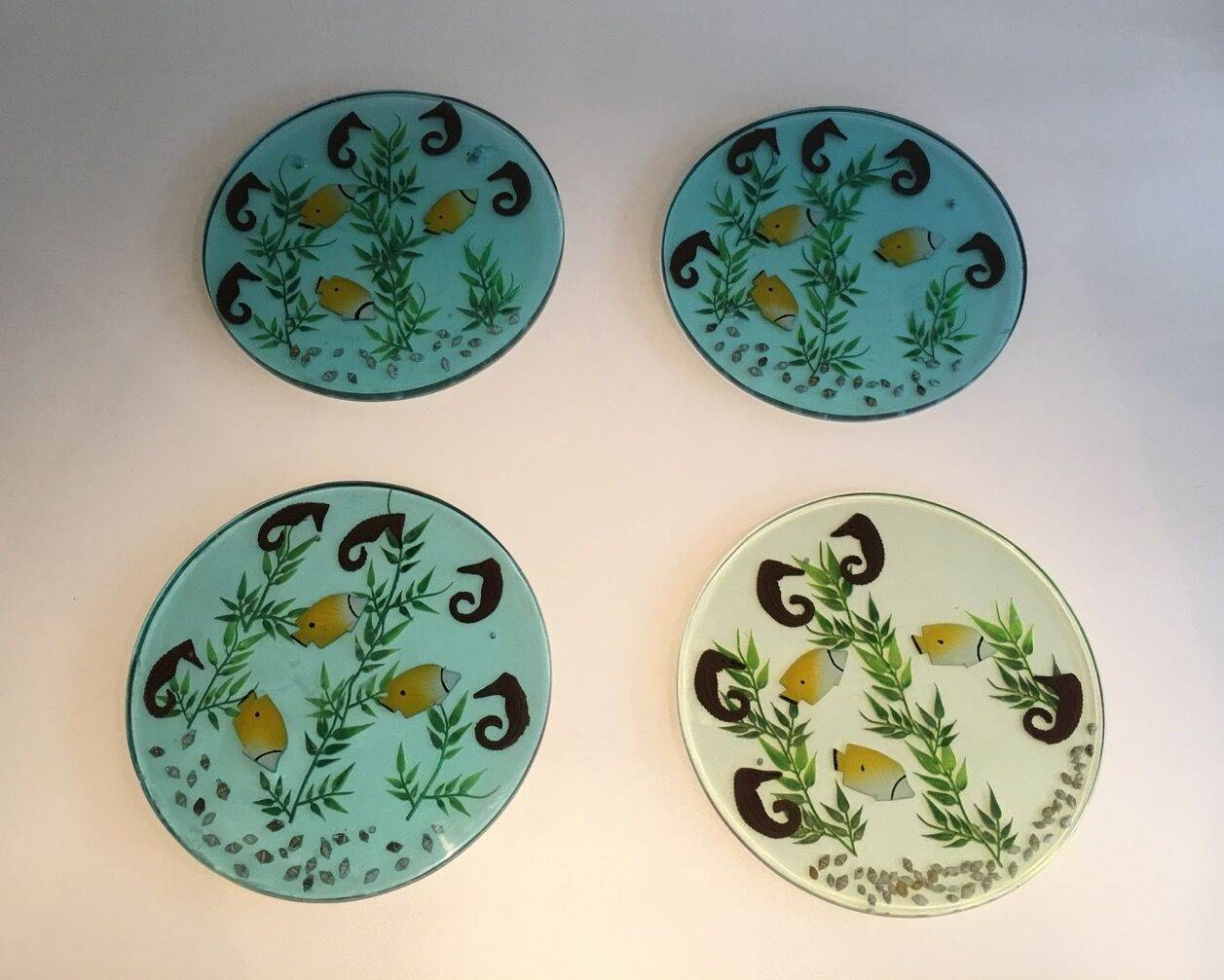 Set of 4 resin trays, inlaid with seahorses, fish, seaweed, and shells.
