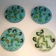 Set of 4 resin trays, inlaid with seahorses, fish, seaweed, and shells.