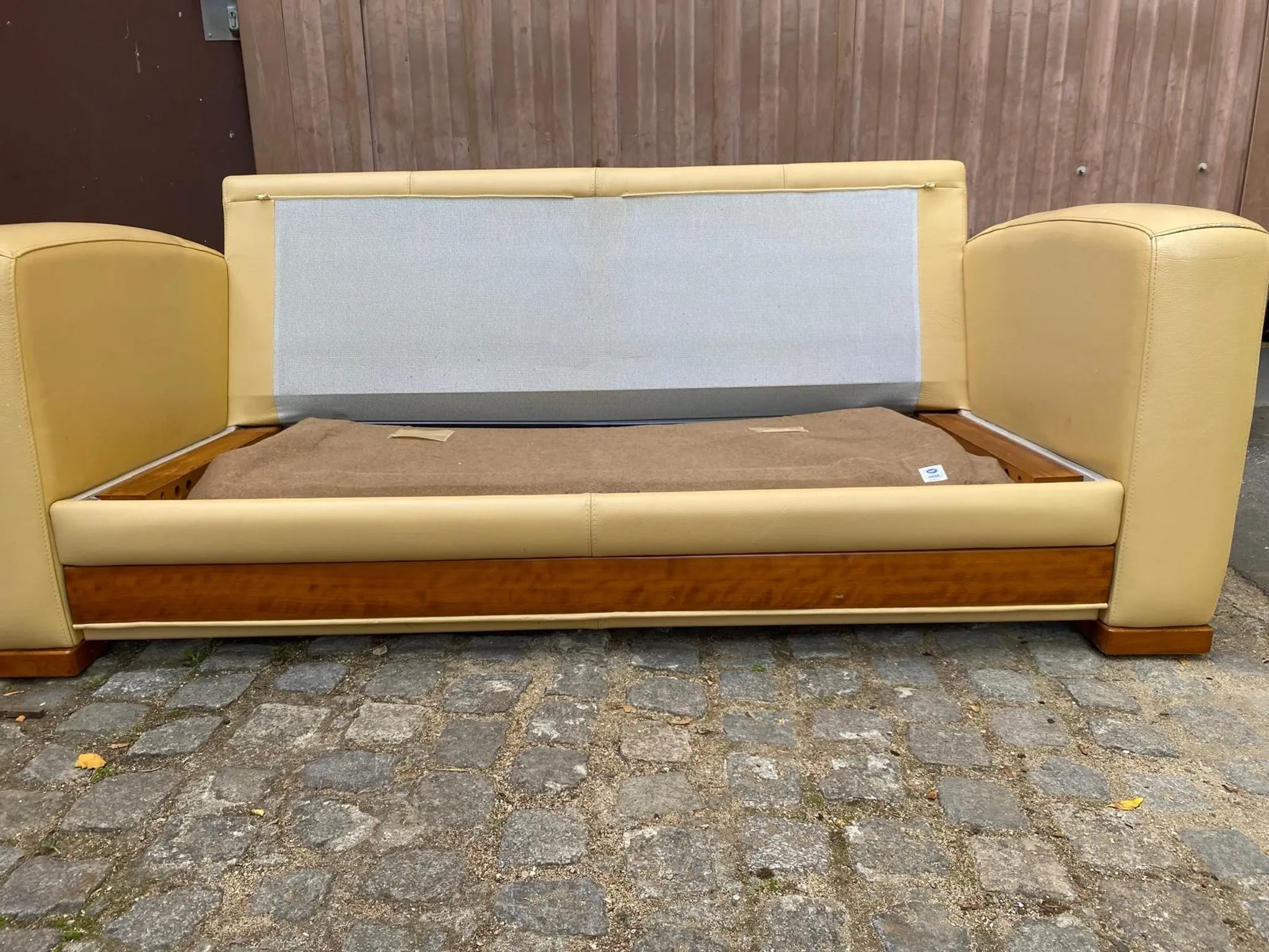 Art Deco 3-seater convertible sofa in genuine beige leather and red fabric from the 1980s.