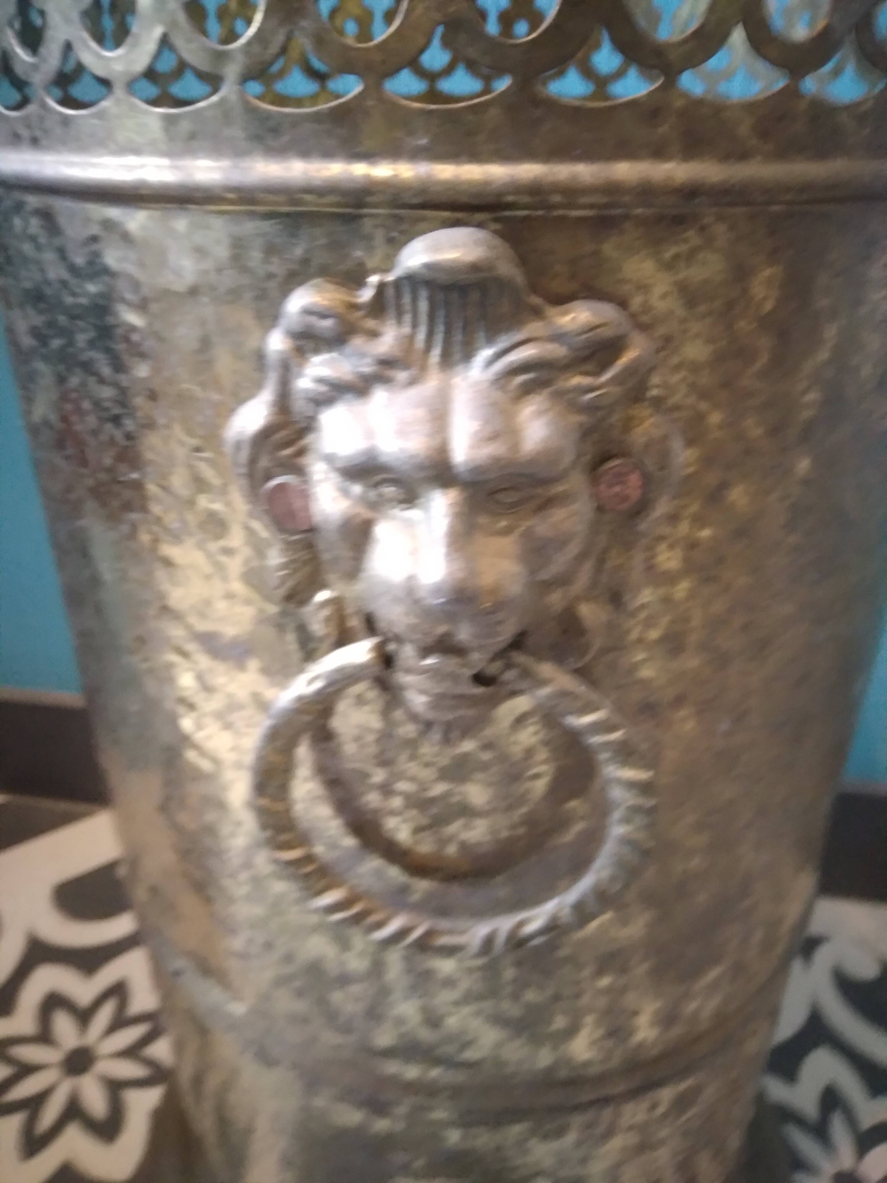 Brass umbrella stand with lion's head