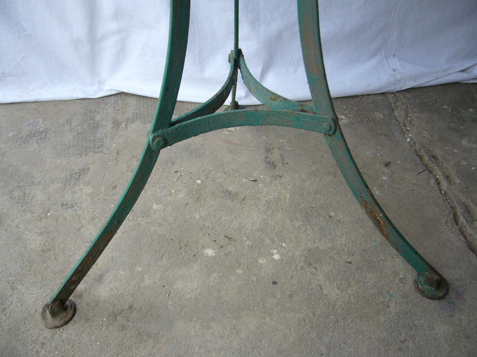 Old riveted metal garden pedestal