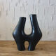 Organic shape vase in black tadelakt