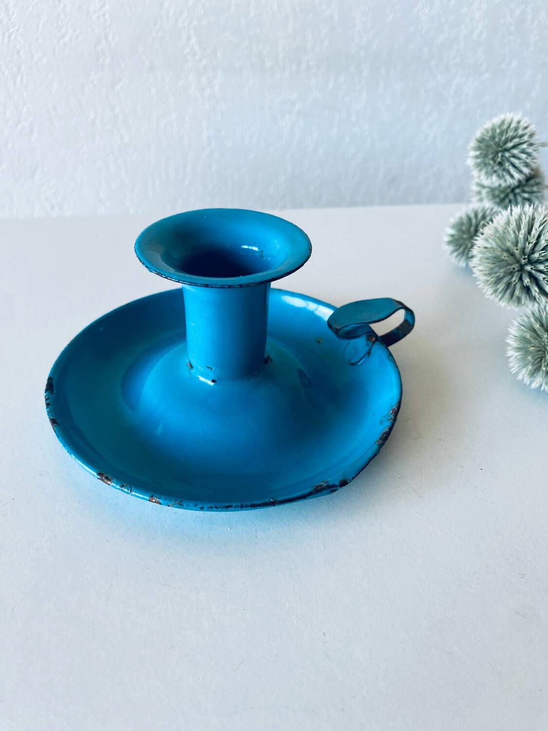 Antique enamelled metal candle holder