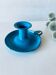 Antique enamelled metal candle holder
