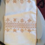 Damask tablecloth with golden patterns