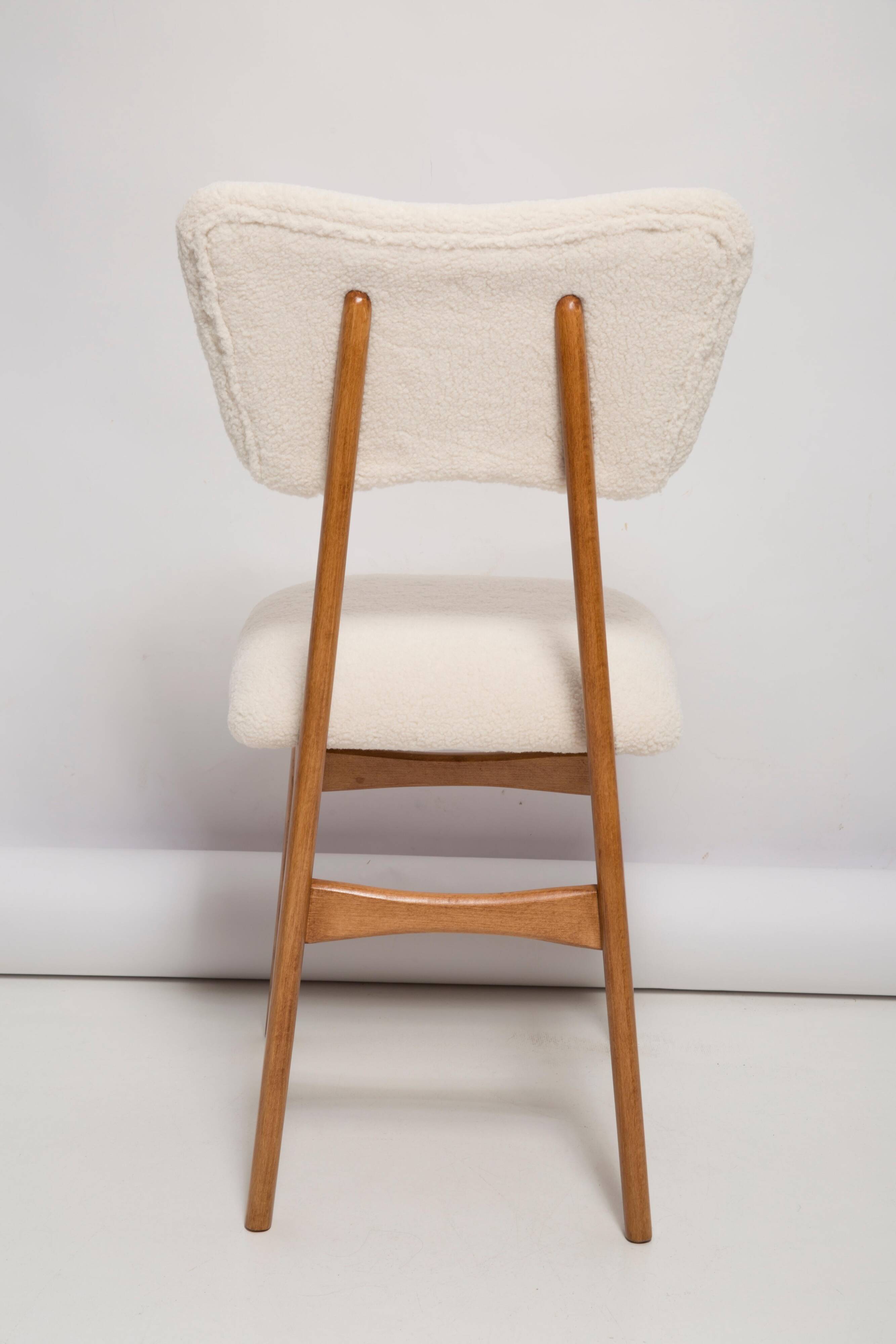 Butterfly chair in beech wood and cream boucle, Europe, 1960