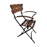 Folding garden chair with teak slats on a wrought iron structure