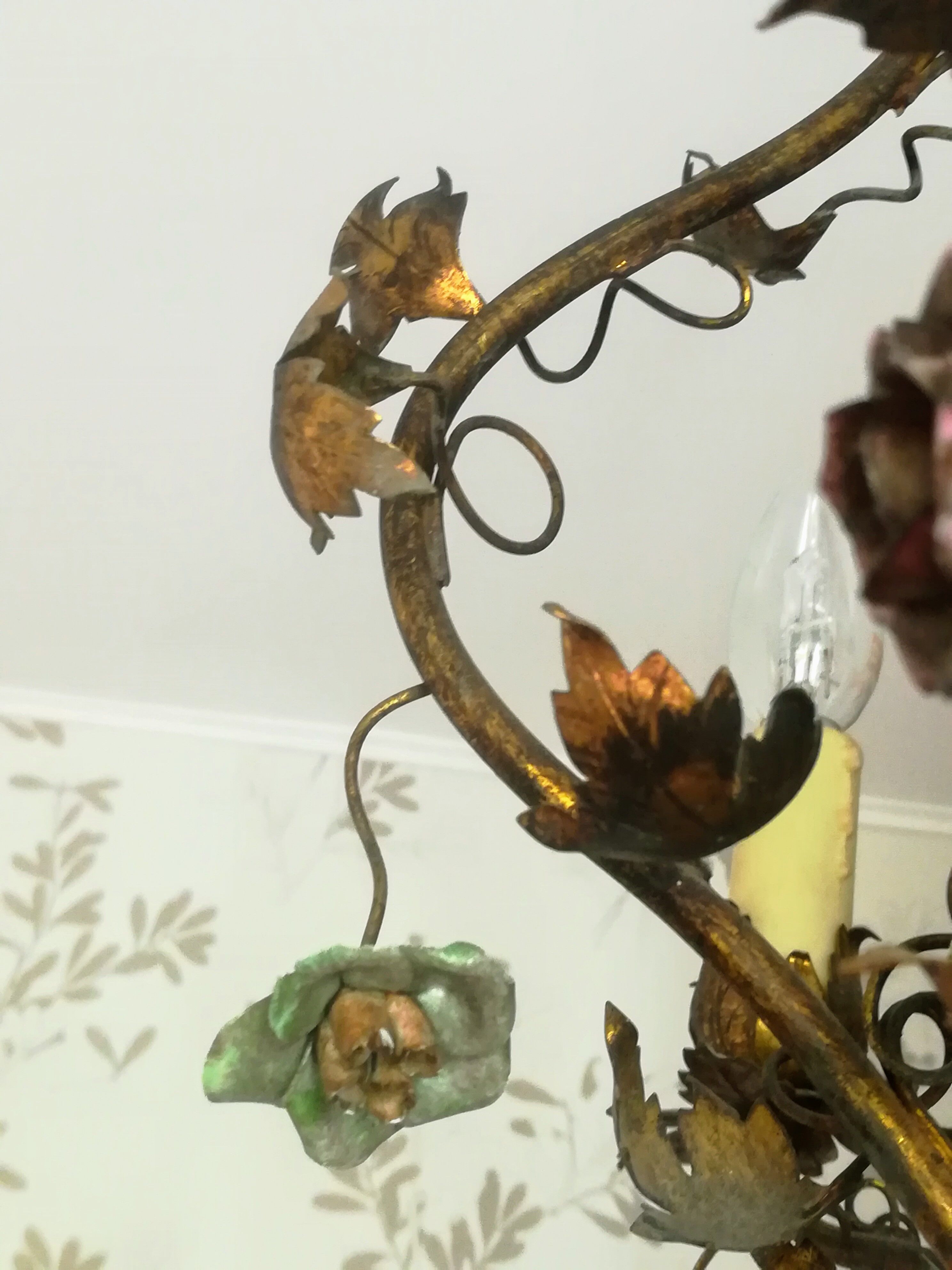 Brass chandelier and porcelain flowers