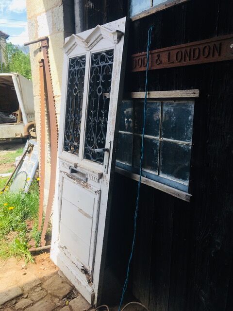 Old door with wrought iron grille