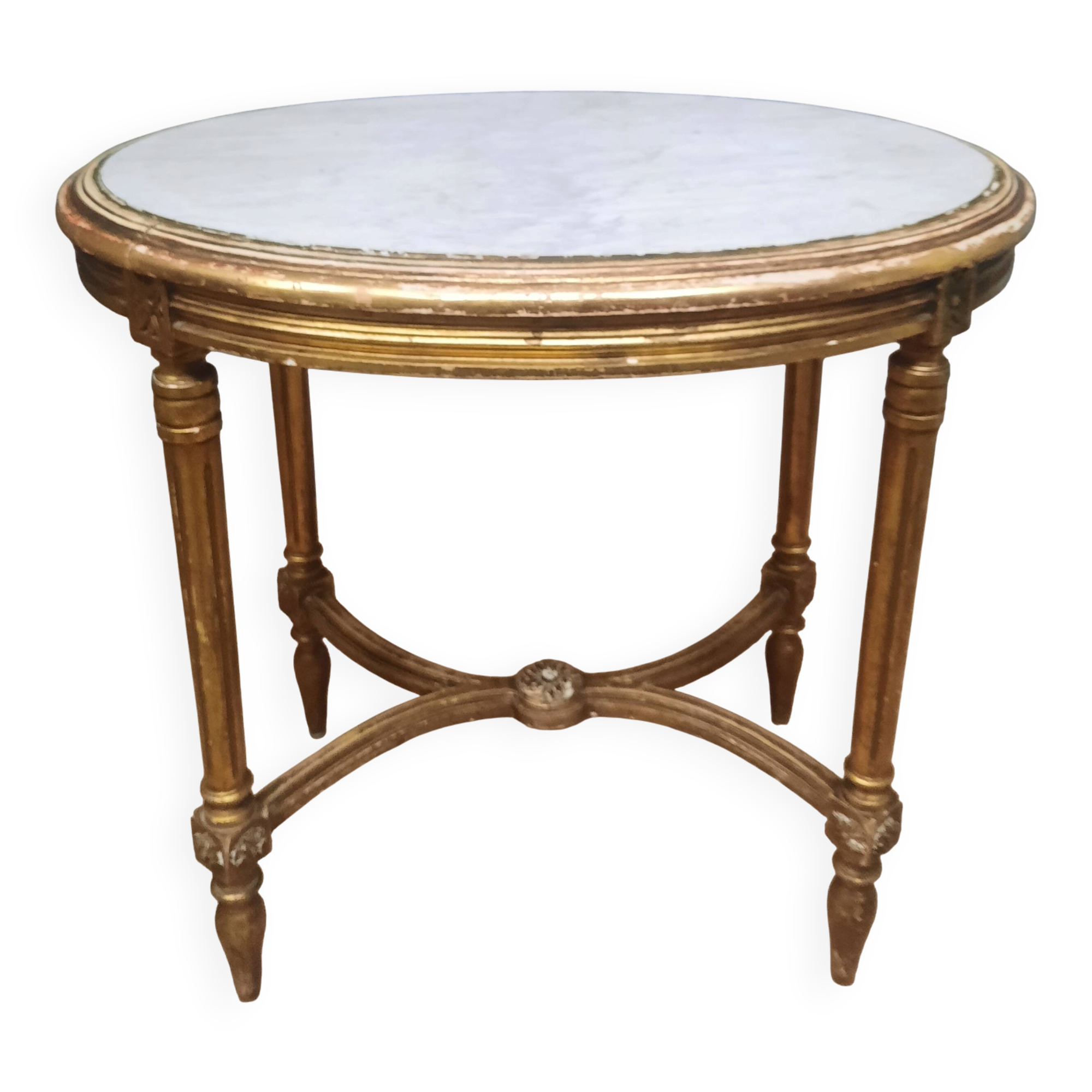 Oval coffee table in gilded wood in the Louis XVI style.