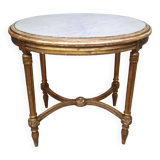 Oval coffee table in gilded wood in the Louis XVI style.
