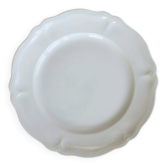 Round vintage ivory earthenware serving dish with scalloped rim.