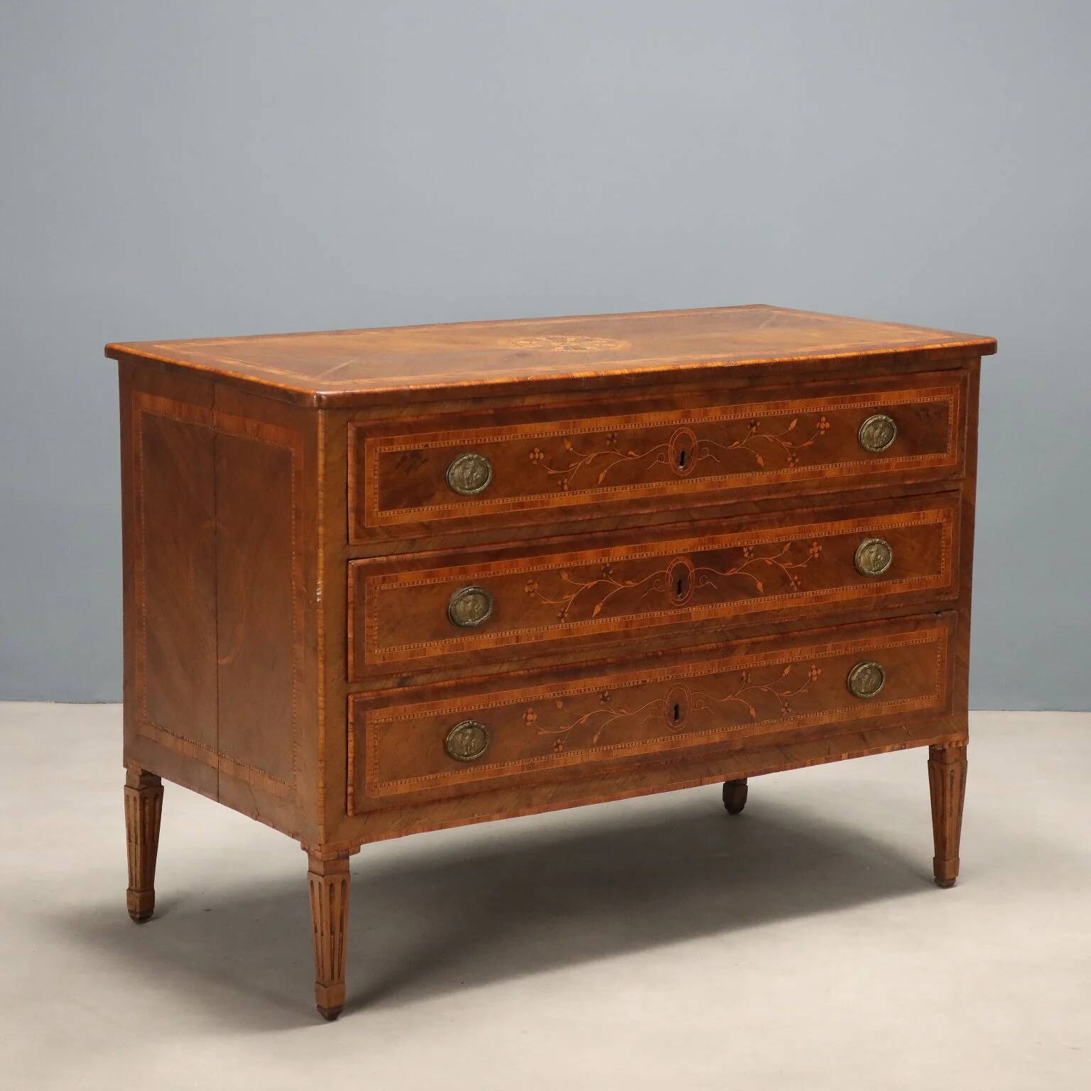 Antique neoclassical walnut commode from the 18th century.