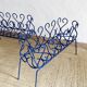 Pair of blue-painted wrought iron planters, 1960s
