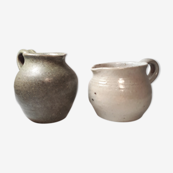 Set of two enamelled sandstone milk pots