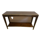 Mahogany console with a golden border.