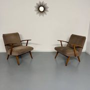 Set of 2 vintage wooden and fabric armchairs designed in the 1960s.
