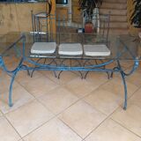 Wrought iron and bevelled glass table with 6 matching chairs.