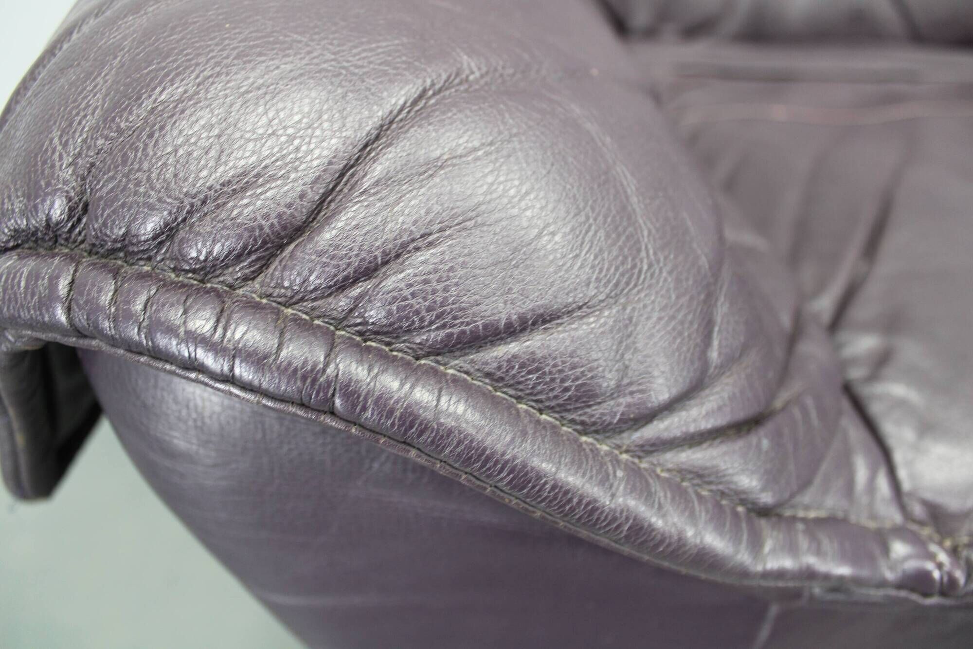 Italian dark purple leather swivel lounge chair, 1980s