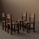 Set of four modernist chairs in oak and straw, France, circa 1960.