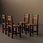 Set of four modernist chairs in oak and straw, France, circa 1960.
