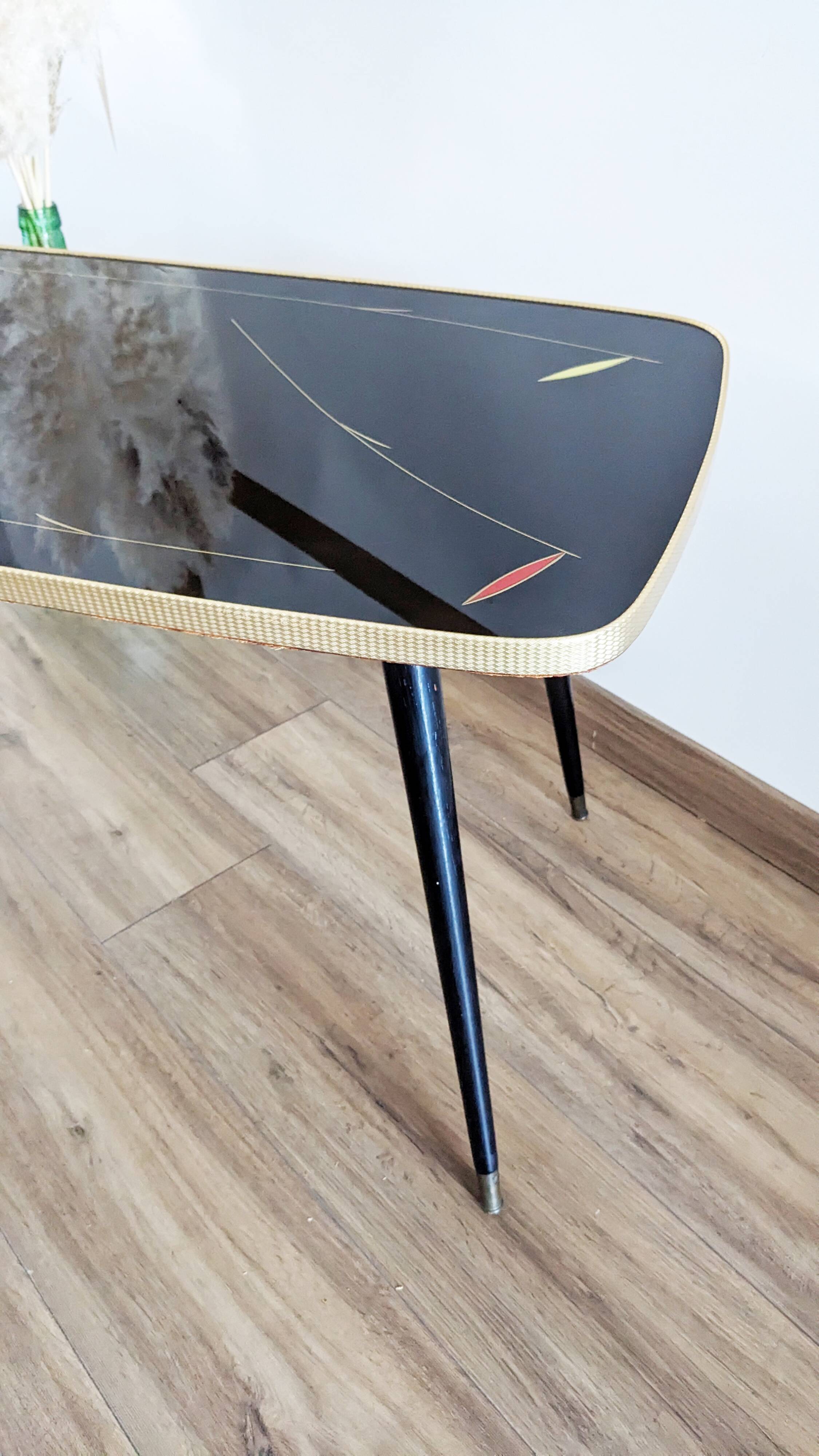 Glass coffee table with spindle legs