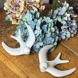 Pair of plaster swallows