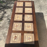 Vintage 60s coffee table with tile decoration of birds and flowers.