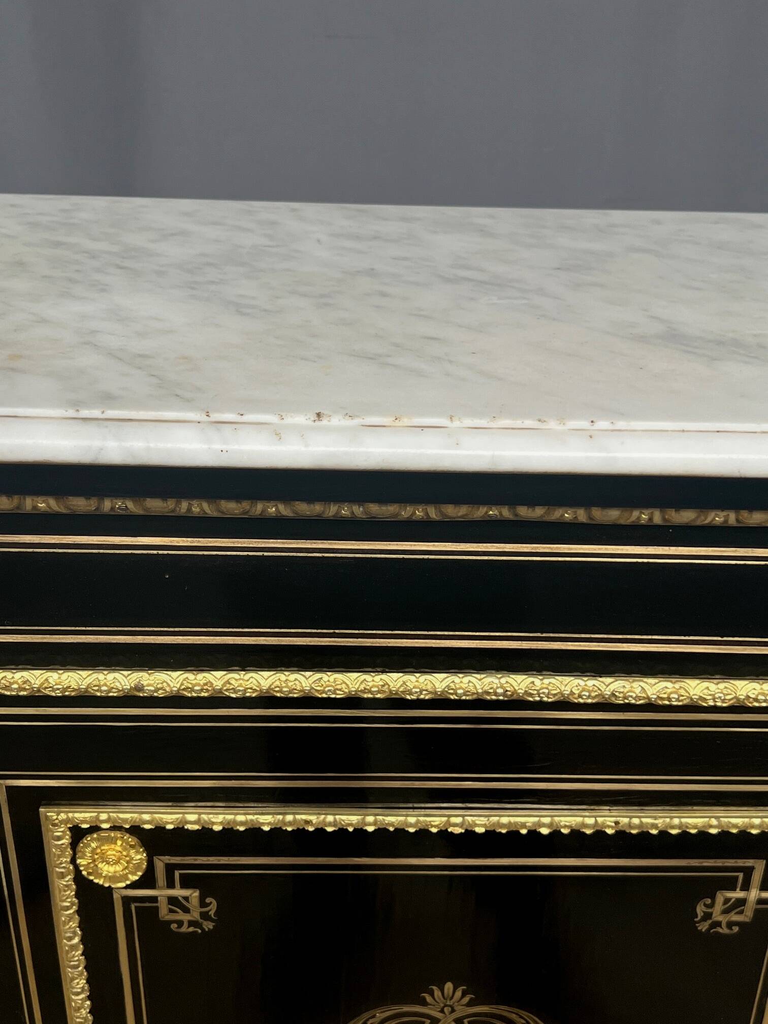 Napoleon III style commode, decorated with brass marquetry and gilded bronze mounts.