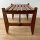 Small modernist wooden bench with vintage slats.