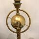 Brass lamp with removable ring around a globe