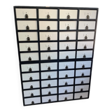 Large black and white industrial chest of drawers in pine, 40 drawers, 1950s.