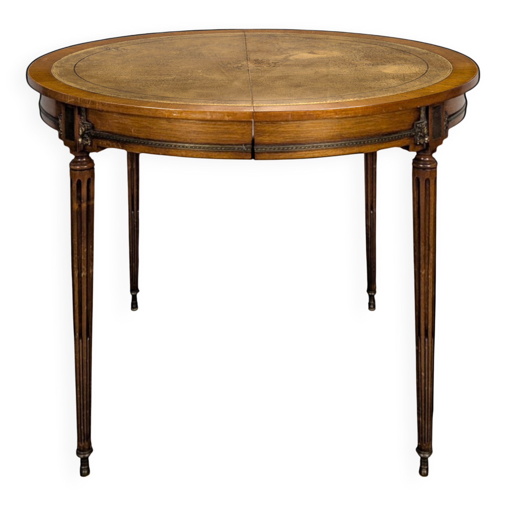 Louis XVI style dining table with a leather top.