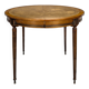 Louis XVI style dining table with a leather top.