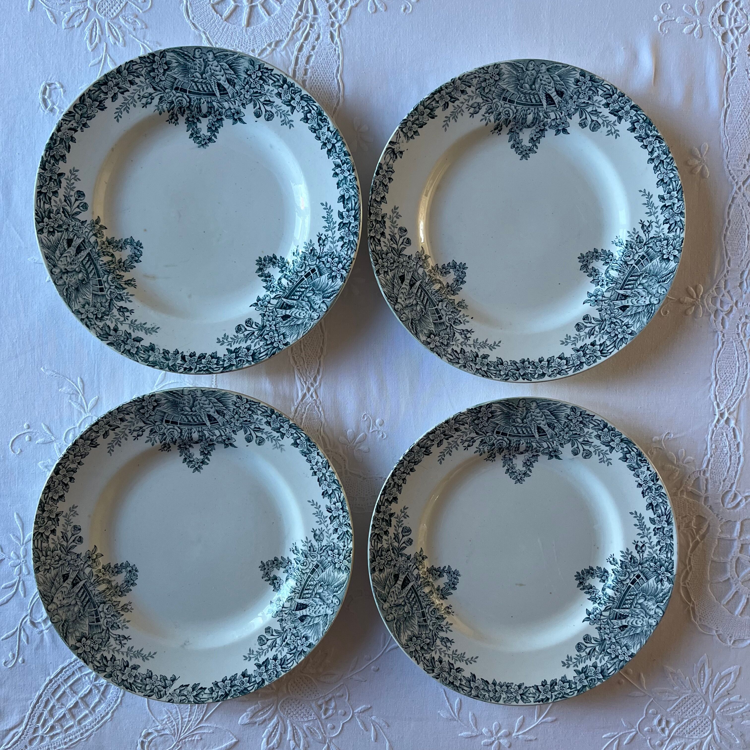 4 iron earth plates decorated with birds