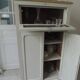 Small vintage piece of furniture sublimated in a linen shade, wooden top.