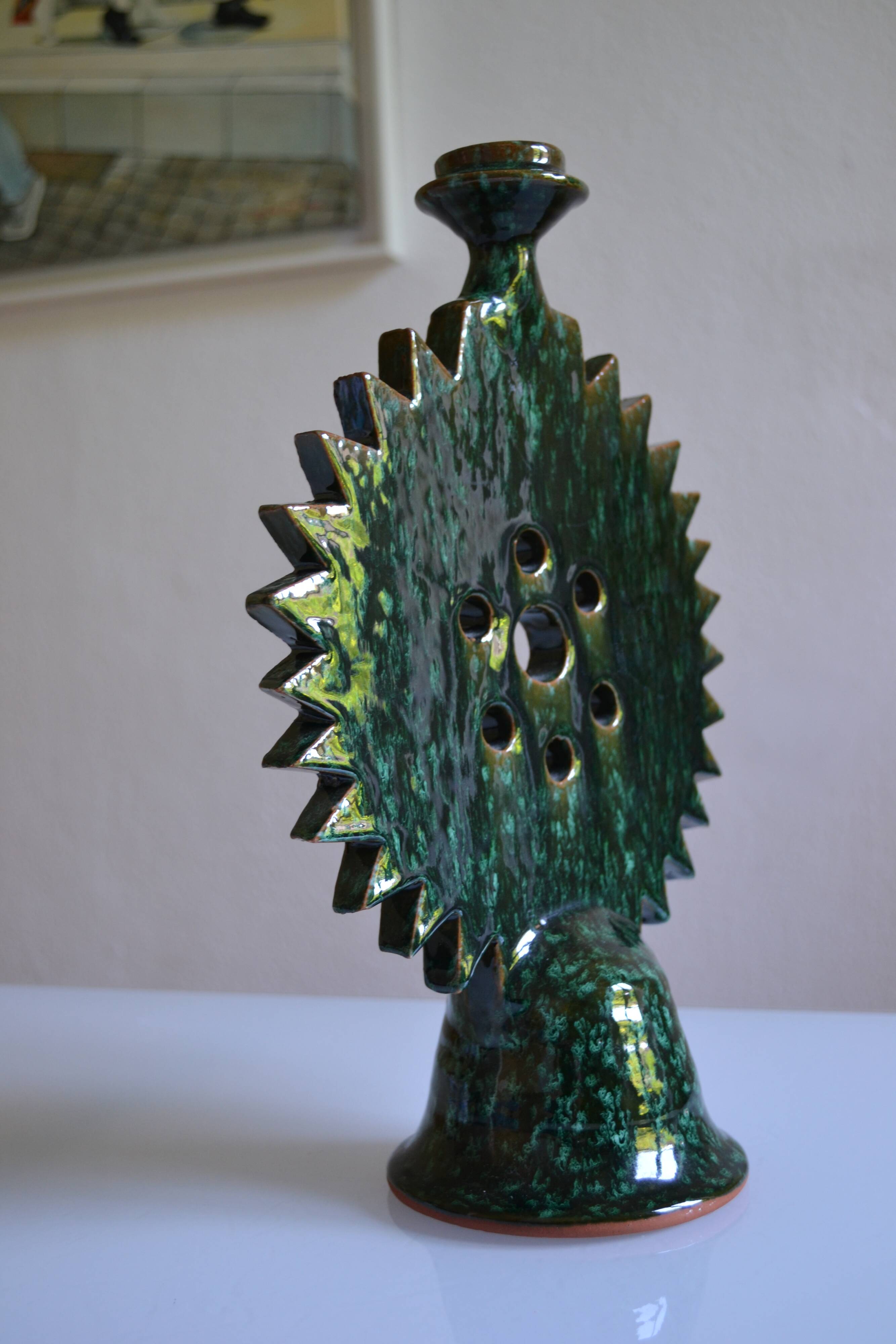 Green ceramic sun candlestick from Tamegroute, Morocco.