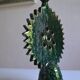 Green ceramic sun candlestick from Tamegroute, Morocco.