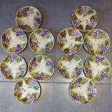 Set of 12 antique earthenware plates in slip with grapes and vines