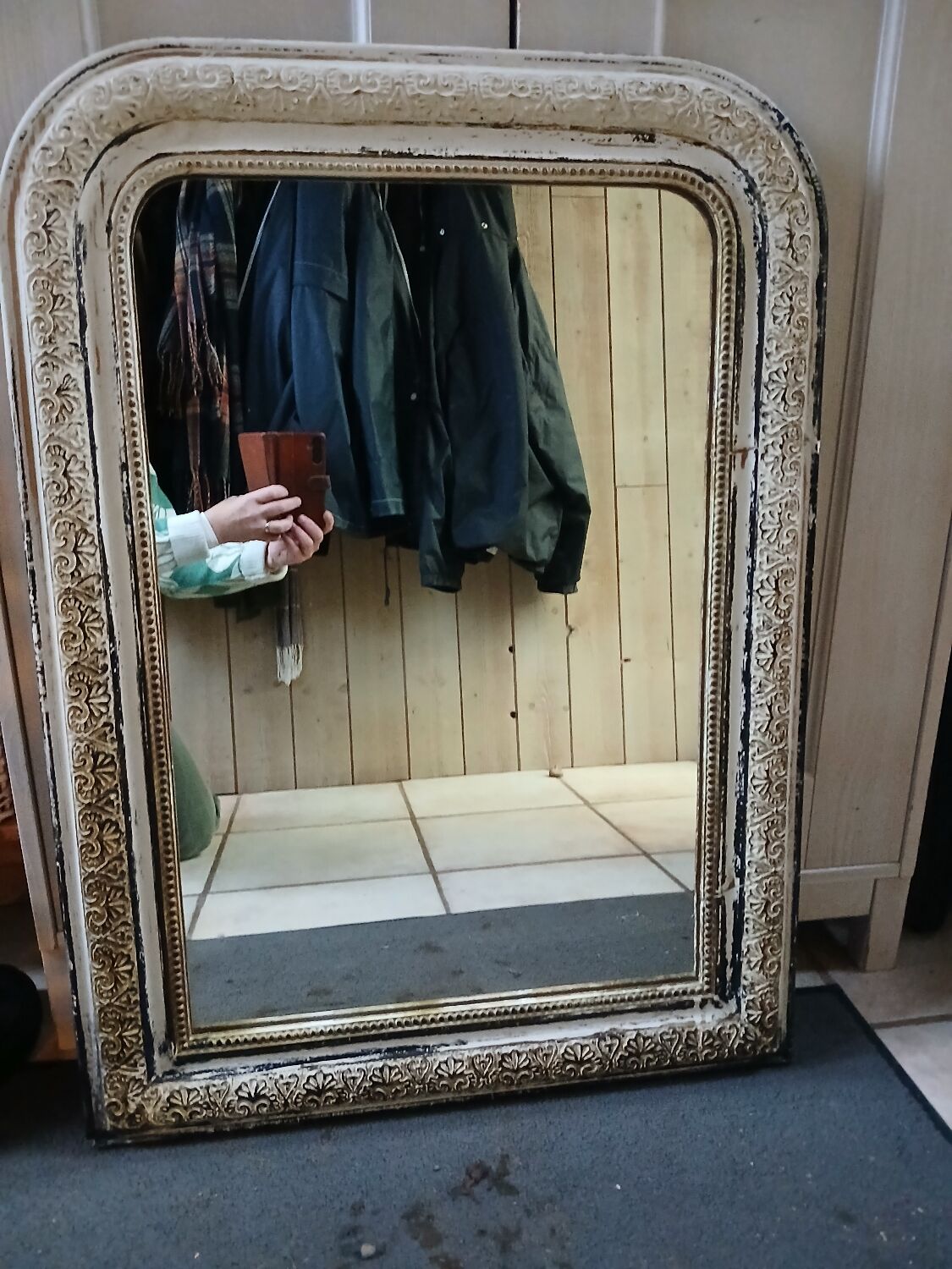 Antique mirror with carved wooden frame