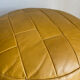 2 poufs moutarde patchwork en cuir de Sède