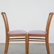 Set of 2 vintage dining chairs from the 1970s with spindle backrest and fabric seat