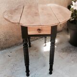 Oval table with flaps