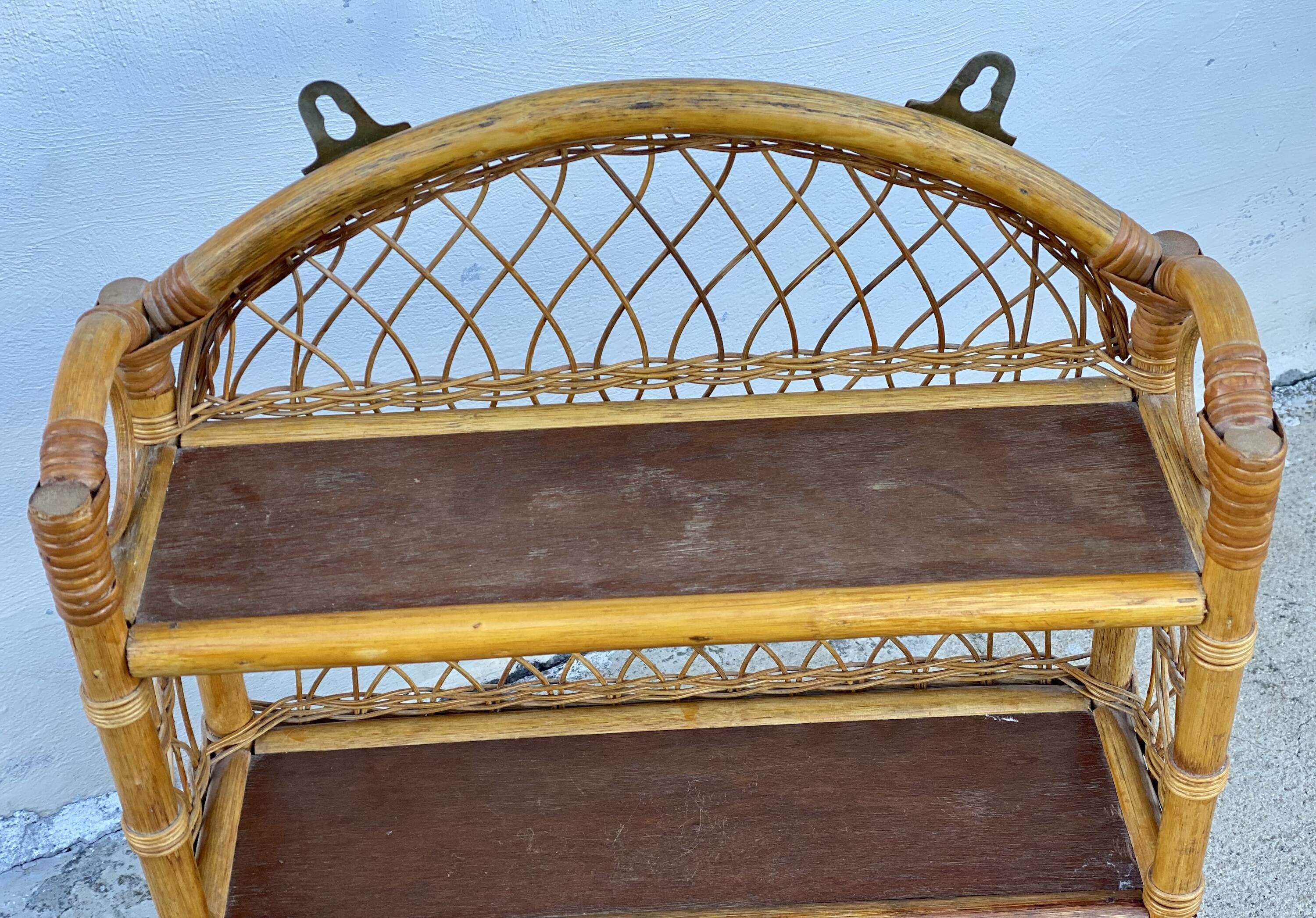 Small vintage 1970s rattan wall shelf with 2 doors.