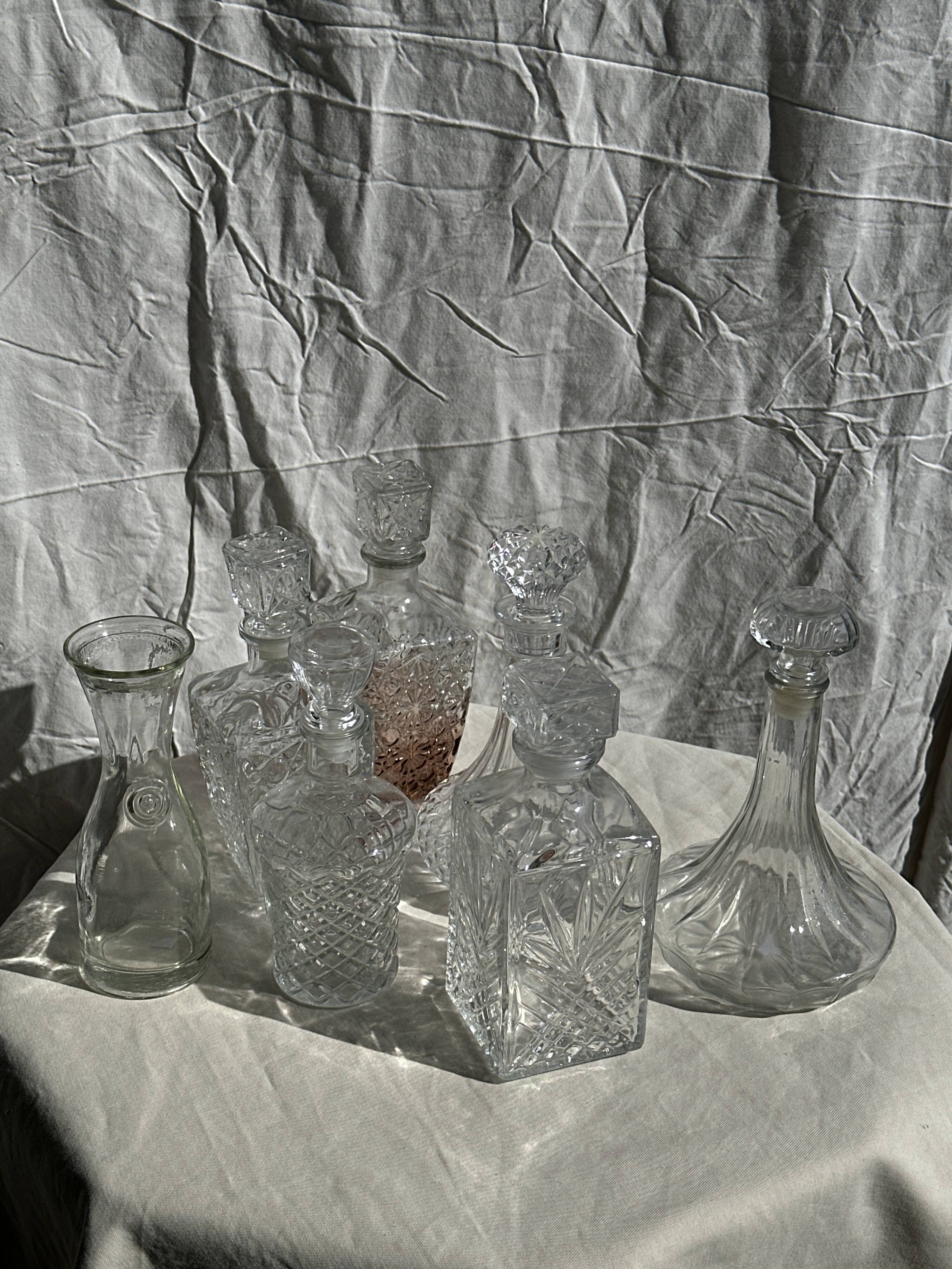 Small cylindrical glass whiskey decanter H:23