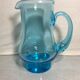 Old blue blown glass pitcher with vintage handle